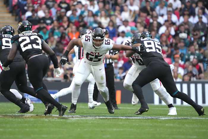 Oct 1, 2023; London, United Kingdom; Atlanta Falcons guard Matthew Bergeron (65) defends against Jacksonville Jaguars defensive end Roy Robertson-Harris (95) in the first half during an NFL International Series game at Wembley Stadium.